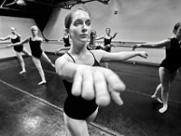 Natalie Wilson, 15, is fully concentrated on performing her best Arabesque Adagio, during the slow movement portion of the floor exercises during E class at the New Bedford Ballet studio on Purchast Street in the north end of New Bedford.   [ PETER PEREIRA/THE STANDARD-TIMES/SCMG ]